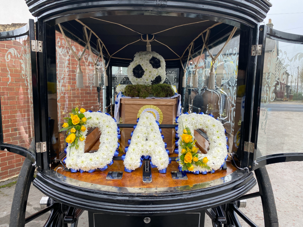 DAD flower letters in hearse