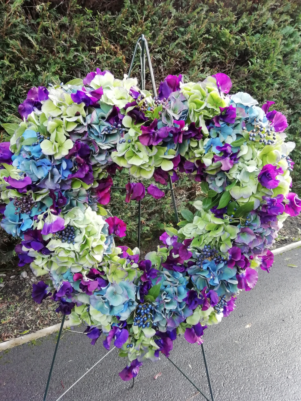 Flowers in the shape of a heart on a stand