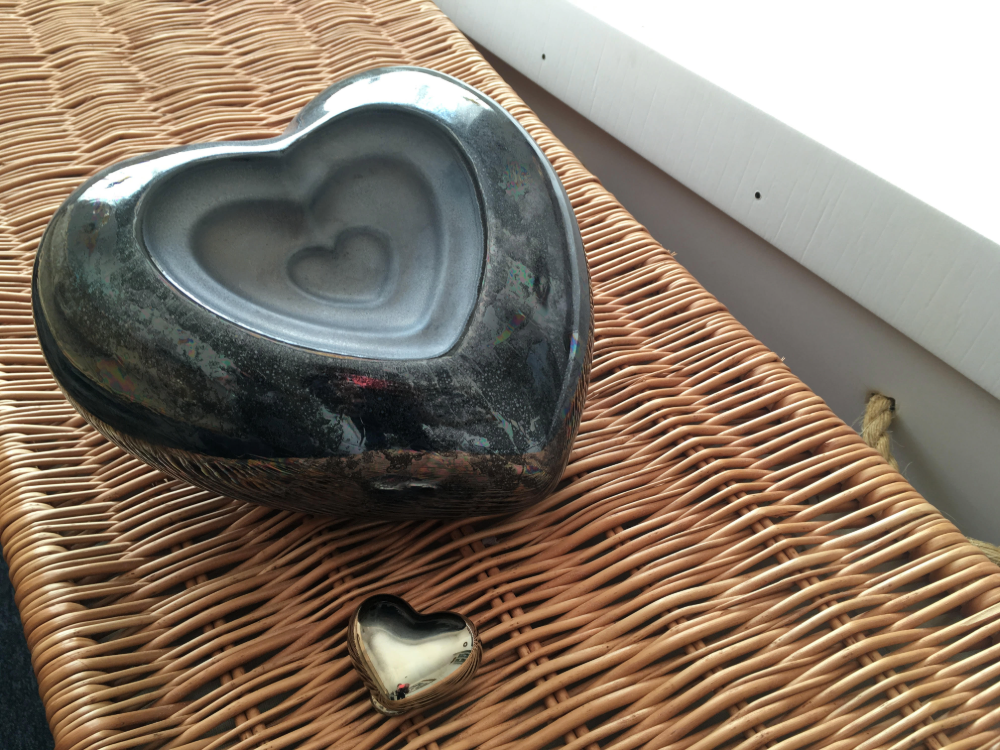 Heart urn on wicker coffin