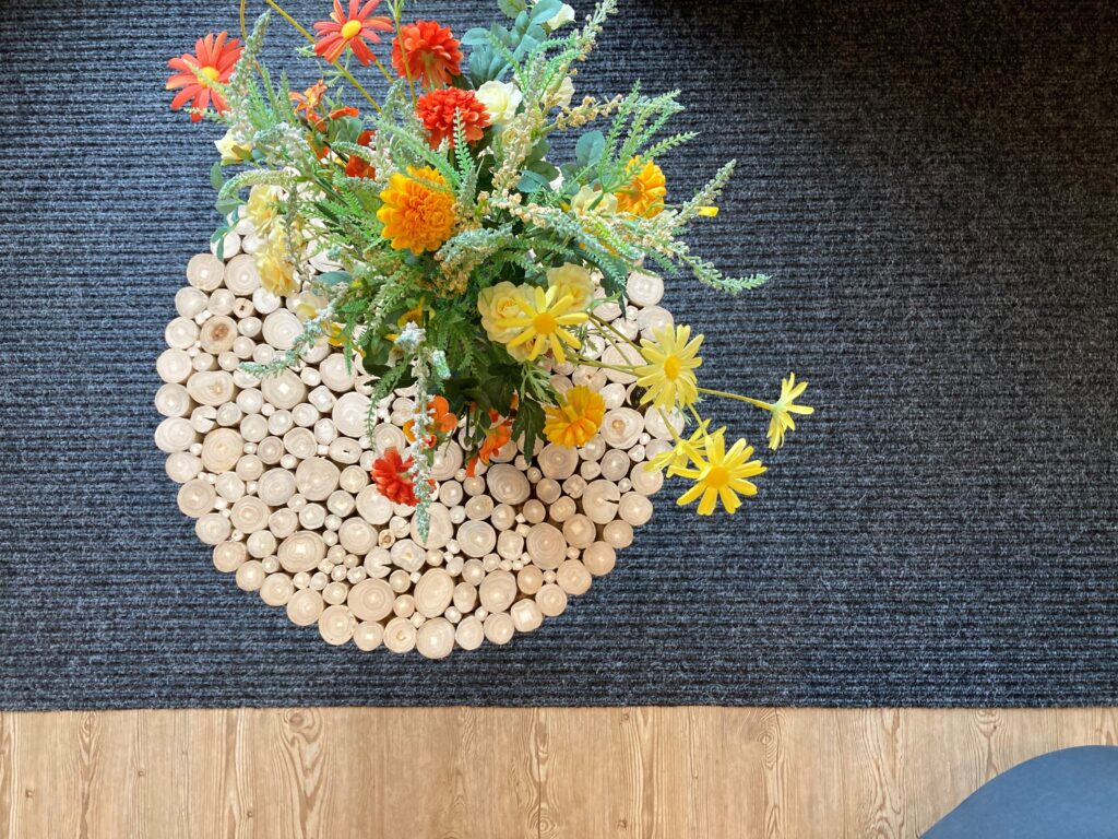 Bright flowers on log table